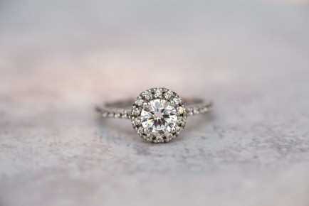 Halo diamond ring with added sparkle on the shoulders